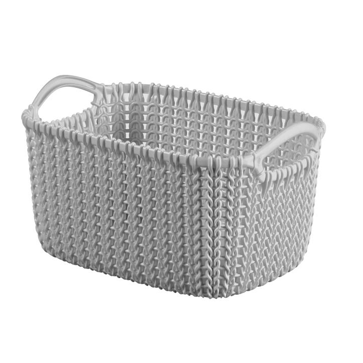 Fehér, téglalap alakú CURVER 'KNIT' kosár, kényelmes fogantyúkkal, 3 literes űrtartalommal. Különleges, kötött hatást keltő design, praktikus tárolási megoldás otthoni vagy irodai használatra. Fehér háttéren fotózva.